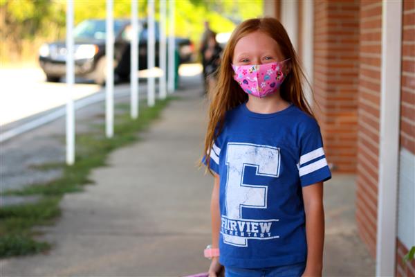 student smiles on first day of school